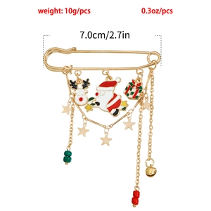 Detail view of gold-plated Christmas safety pin brooch with Santa and Reindeer charms