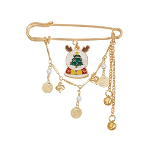 Detail of a gold Christmas brooch featuring a snow globe charm with reindeer antlers