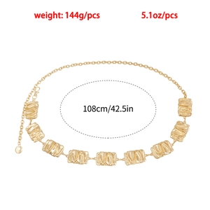 Detail of gold metal waist chain with irregular geometric wrinkled plates and lobster clasp