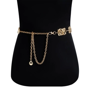 Detail of adjustable gold metal waist chain with geometric textured plates and fringe tassels