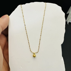 Minimalist 18K gold titanium steel necklace with small round ball pendant on white base