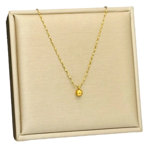 Minimalist 18K gold-plated titanium steel necklace with a polished bead pendant on silk