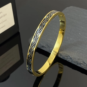 Brazalete vintage de acero inoxidable dorado con motivos de ojo turco en esmalte azul
