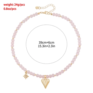 Detailed view of pink beaded heart necklace with dimensions of 39cm length and 24g weight