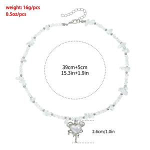 Detail view of heart pendant necklace with irregular clear stones and size dimensions