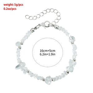 Detail view of crushed clear quartz beads and metal balls with silver lobster clasp