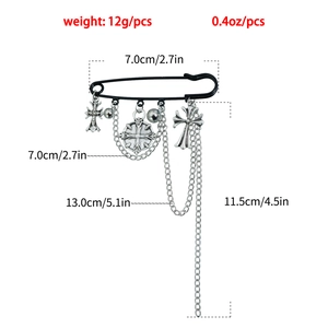 Detailed view of Gothic cross tassel brooch with size specs and metal chain pendants