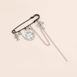 Gothic punk safety pin brooch with silver crosses and dangling chain tassels on black metal