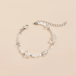 Detail of beaded bracelet with clear irregular stones, silver beads and lobster clasp