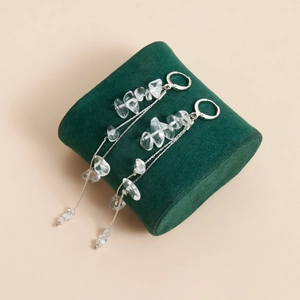 Silver drop earrings with long metal tassels and clear irregular stone beads detail