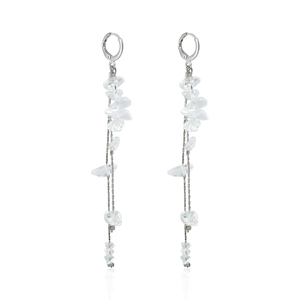 Detail of silver long tassel earrings with clear irregular stones and metal fringe