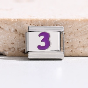 Macro view of stainless steel charm link with purple enamel number 3 for DIY bracelets