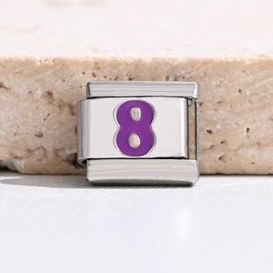 Macro detail of Italian charm link featuring a purple number 8 on stainless steel