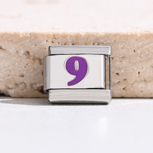 Detail of Italian charm link with purple number 9 on brushed stainless steel