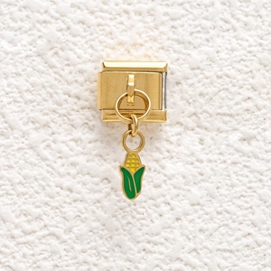 Detail view of Italian charm link featuring a golden corn pendant with yellow enamel inlay