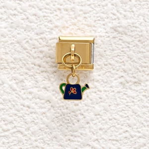 Italian charm link with a blue enamel watering can pendant and floral detail