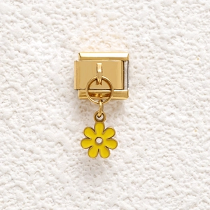 Golden stainless steel modular charm bracelet link featuring a yellow daisy enamel flower