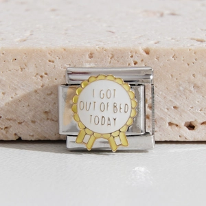 Italian style stainless steel modular charm bracelet featuring an 'I got out of bed' medal