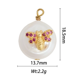 Detailed macro of a 18k gold bee pearl pendant with pink gems and size measurements