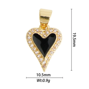 Detailed view of heart pendant with black enamel center and sparkling cubic zirconia stones