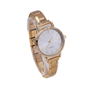 Elegant gold quartz watch with rhinestones and Roman numerals on a white dial