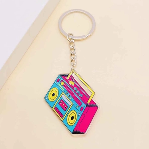 Retro radio cassette player keychain with vibrant pink blue and yellow enamel details