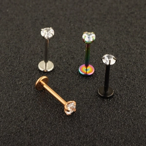 Detail of four-piece stainless steel labret studs with inlaid AAA cubic zirconia gems