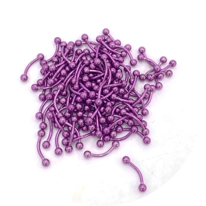 Close-up of bulk purple plated stainless steel curved barbells for eyebrow and lip piercing
