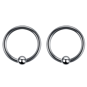 Close-up of a pair of polished stainless steel captive bead rings with silver finish
