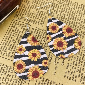 Faux leather sunflower and zebra pattern teardrop earrings with a textured finish