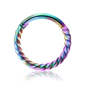 Macro shot of rainbow stainless steel twisted seamless hoop for nose or ear piercings