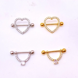 Detail of heart-shaped stainless steel nipple rings set with pavé cubic zirconia