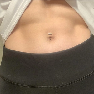 Barbell belly button ring in stainless steel featuring a minimalist rectangle and bead