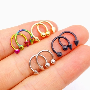 Horseshoe piercing jewelry in four colors with ball and cone ends on stainless steel rings
