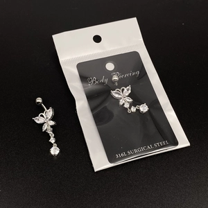 Detail of butterfly navel ring crafted from 316L surgical steel with cubic zirconia