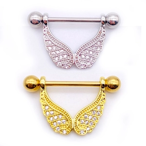 Detailed view of silver and gold nipple rings with zircon-inlaid angel wings jewelry