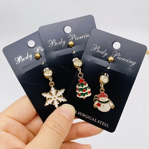 Set van drie navelpiercings van chirurgisch staal met sneeuwvlok, kerstboom en sneeuwpop