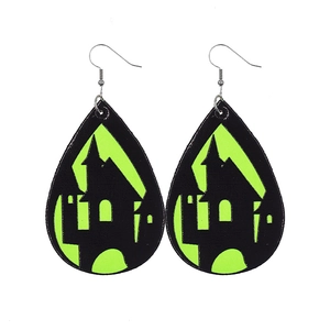 Close-up of teardrop Halloween earrings with fluorescent green haunted castle design