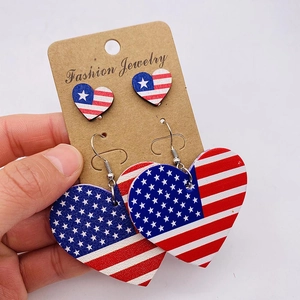 Independence Day American flag heart earrings set with wood texture on display card