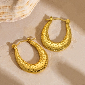 Elegant gold-plated stainless steel hoop earrings with hammered texture on stone surface