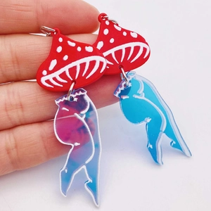 Quirky acrylic mushroom leg earrings featuring a red mushroom top and blue bikini legs