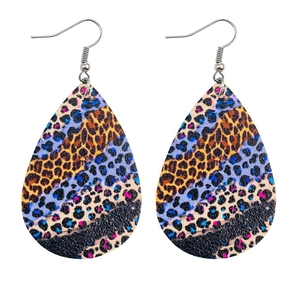 Detail of colorful leopard print teardrop earrings in orange, blue, and pink leather