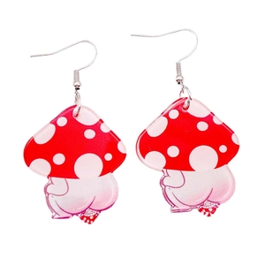 Cute acrylic red spotted mushroom earrings with funny aesthetic on white background