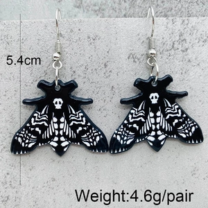 Detailed view of skull moth acrylic earrings showing 5.4cm length and 4.6g weight
