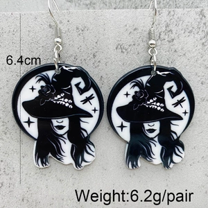 Detail view of 6.4cm acrylic witch earrings with weights and dimensions on gray card