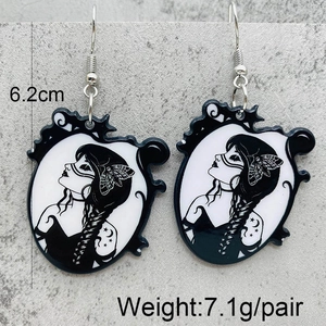 Detail showing 6.2cm height measurement of gothic acrylic earrings with female portrait