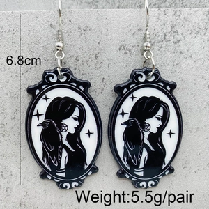 Gothic acrylic oval earrings with crow silhouette, 6.8cm long and 5.5g per pair