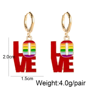 Detail view of LOVE earrings with rainbow stripe O letter and size dimensions info