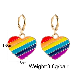 Detailed size view of colorful rainbow enamel heart earrings with gold metal hooks