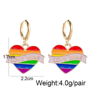 Detailed close-up of rainbow heart earrings with Love Wins text and size measurements